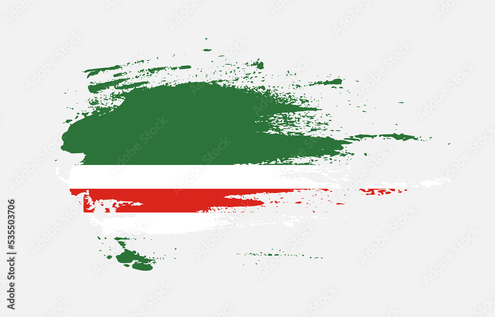 Grunge brush stroke flag of Chechen Republic of Ichkeria with painted brush splatter effect on solid background Grunge brush stroke flag of Chechen Republic of Ichkeria with painted brush splatter effect on solid background