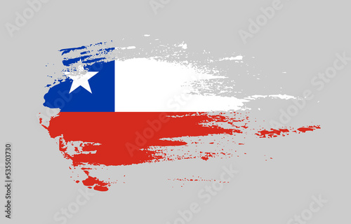 Grunge brush stroke flag of Chile with painted brush splatter effect on solid background