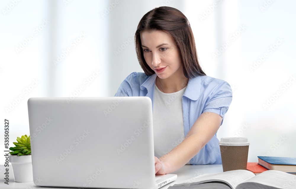 Young business woman work on computer at office Young business woman work on computer at office