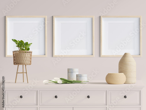 living interior with 3 blank picture frames cover