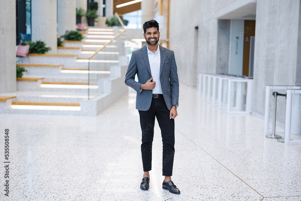 Confident young businessman in an office building
Confident young businessman in an office building