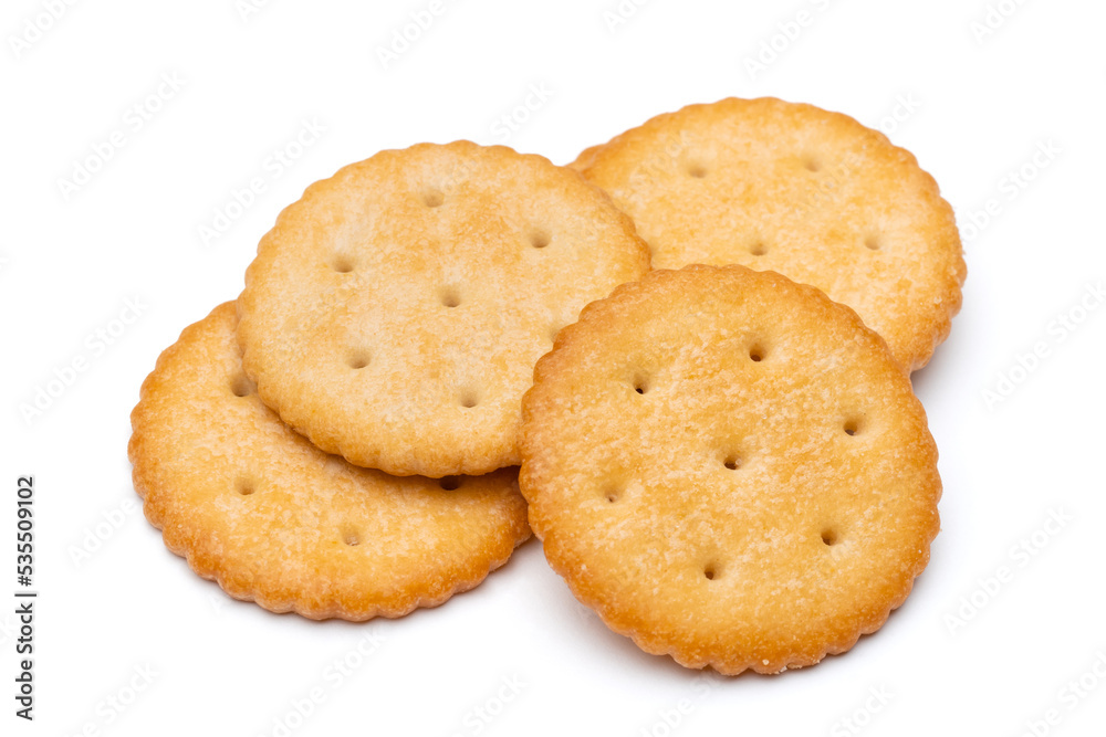 Healthy whole wheat cracker on white background. Stack of Saltine crackers isolated on white background. Round crackers. Healthy whole wheat cracker on white background. Stack of Saltine crackers isolated on white background. Round crackers.