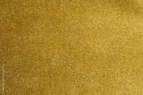 Abstract gold glitter sparkle bokeh light background. Merry Christmas and Happy New Year. Christmas, winter, new year concept. Greeting card, banner with place for text. Winter holiday xmas theme