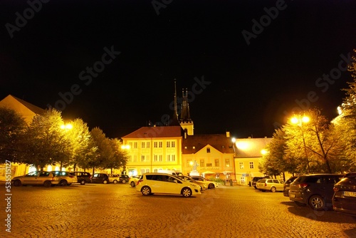 Louny historical city center, Czechia landscape view of historical old city Louny Ceske stredohori Czech republic panorama church and old houses and fortifications and main town square,Jan Hus statue	 photo