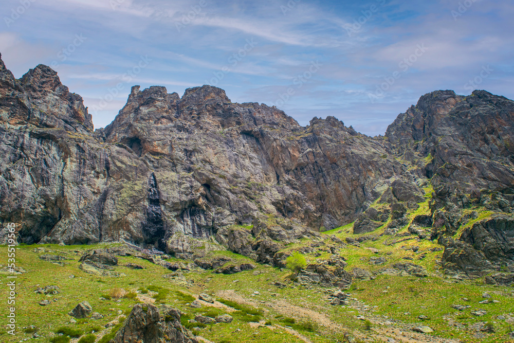 Obraz premium Path to Raiskoto praskalo waterfall and Botev peak in Balkan mountain, Bulgaria