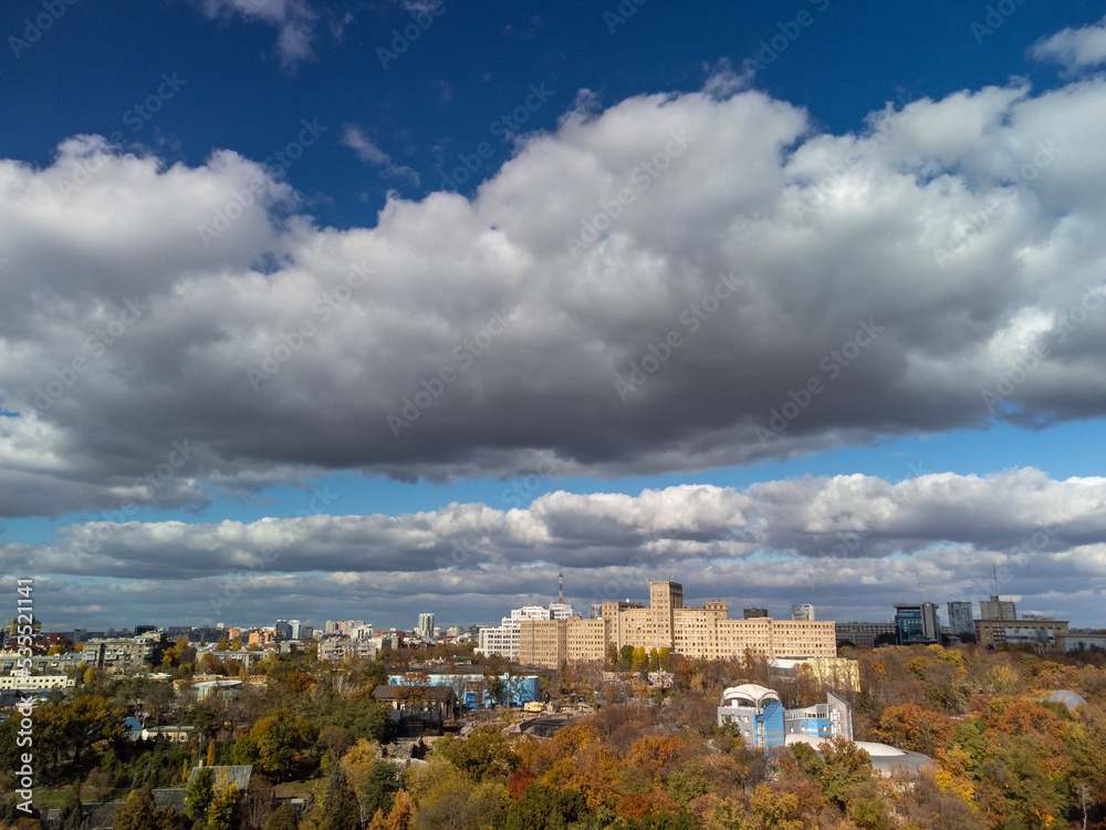 Aerial autumn historical university buildings in city center. Tourist attractions near Shevchenko City Garden park with scenic sky in Kharkiv, Ukraine