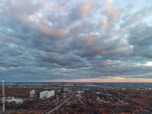 Aerial autumn evening city view. Residential district with park and scenic cloudy sky. Kharkiv, Ukraine © Kathrine Andi