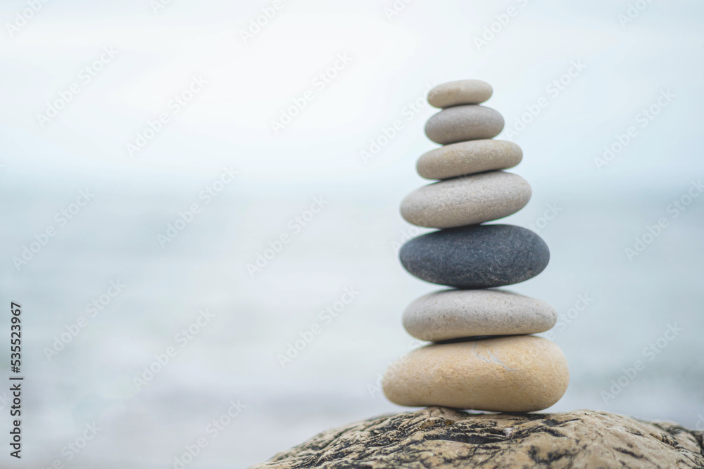 © kostikovanata - Pebble tower balance harmony stones arrangement on sea beach coastline peaceful formation pyramid © kostikovanata - Pebble tower balance harmony stones arrangement on sea beach coastline peaceful formation pyramid