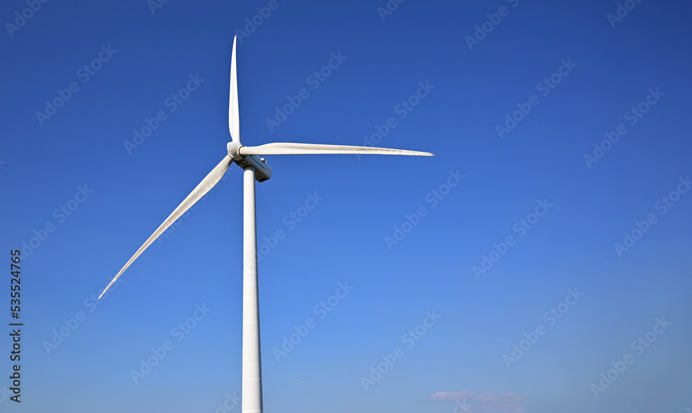 Wind energy. Clean renewable energy technologies. Wind power plants.Aerial view of horizontal-axis wind turbines generating electricity Wind energy. Clean renewable energy technologies. Wind power plants.Aerial view of horizontal-axis wind turbines generating electricity
