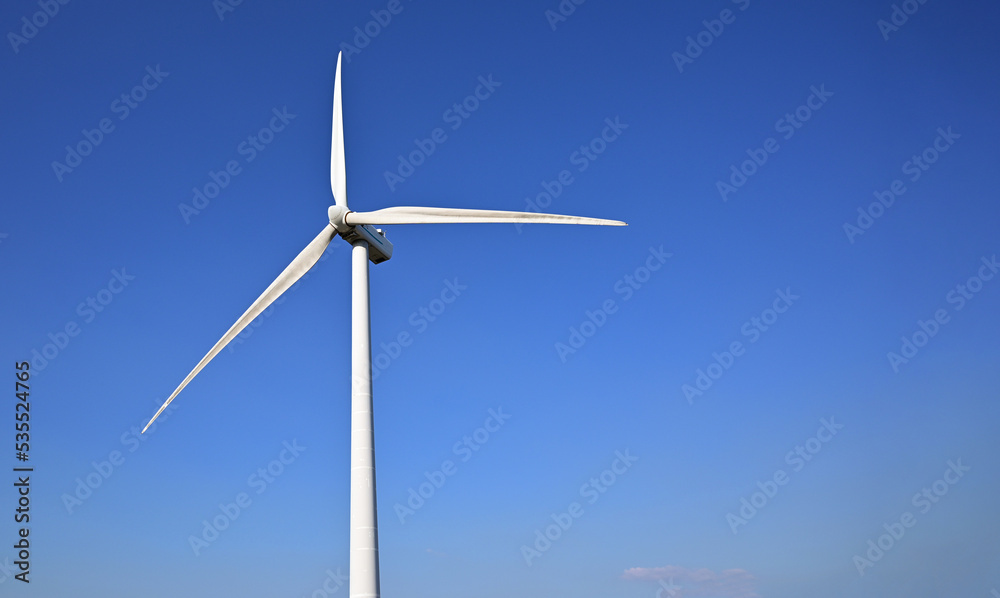 Wind energy. Clean renewable energy technologies. Wind power plants.Aerial view of horizontal-axis wind turbines generating electricity 