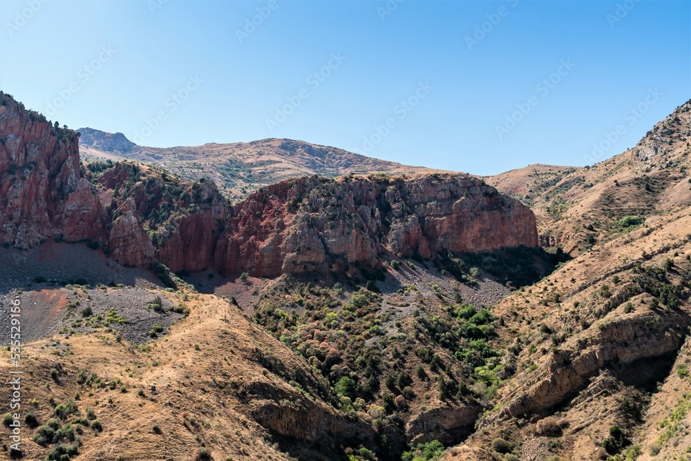 Red rocks among the mountain landscape in the mountains of Armenia.