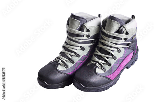 women's trekking boots on a white background. mountain women's tourism concept. hiking boots on light texture. shoes for working on light surfaces