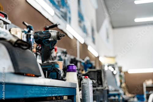 Large workbench with tools at station for vehicle technical servicing