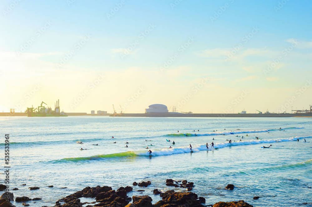 Surfers Matosinhos Leixoes Port sunset