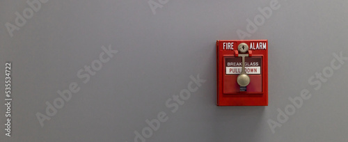 Fire alarm on the wall. Emergency of Fire alarm or alert or bell warning equipment. Fire alarm box on cement wall for warning and security system in the condominium place. 