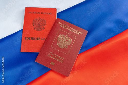 Canvas Print Russian foreign passport and military id serviceman of  citizen of the Russian Federation on Russian flag