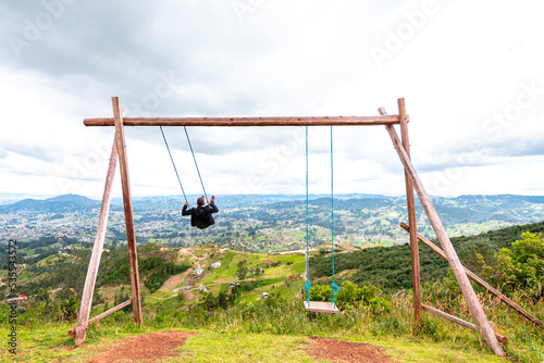 a giant swing at the edge of a cliff
