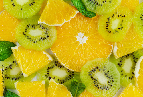 Texture of oranges, kiwi and mint