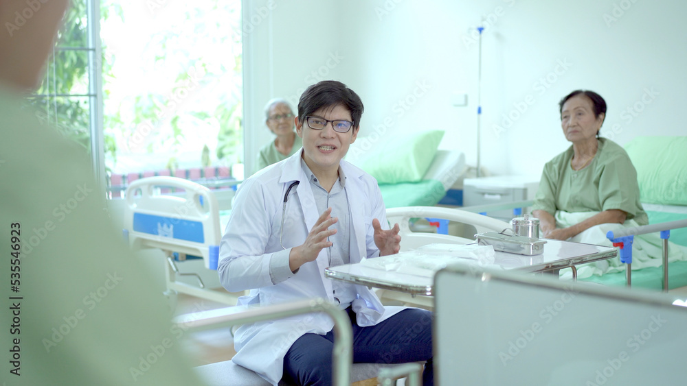 Obraz premium Elder Asian man practicing a physical therapy with professional therapist in hospital.