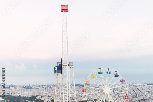 Ferris wheel in modern amusement park in city photo