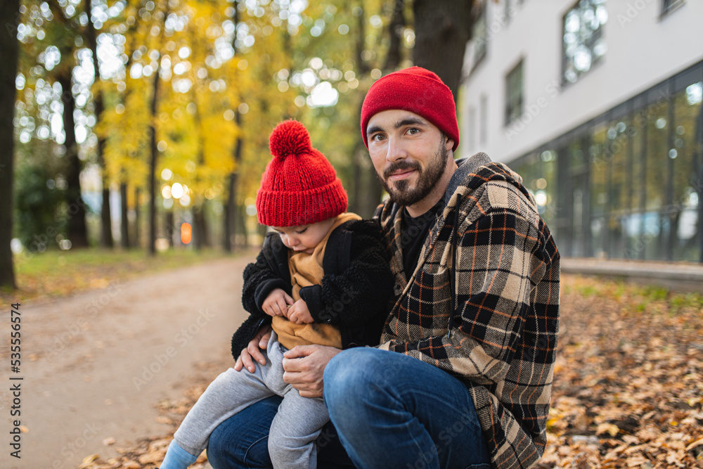 Fototapeta premium A father and his son spend time together. Happy parenthood. Father and toddler. Parental love.