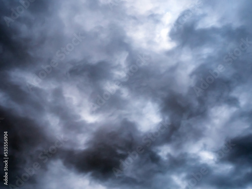 Grey tragic cloudscape with chaotic dark clouds
