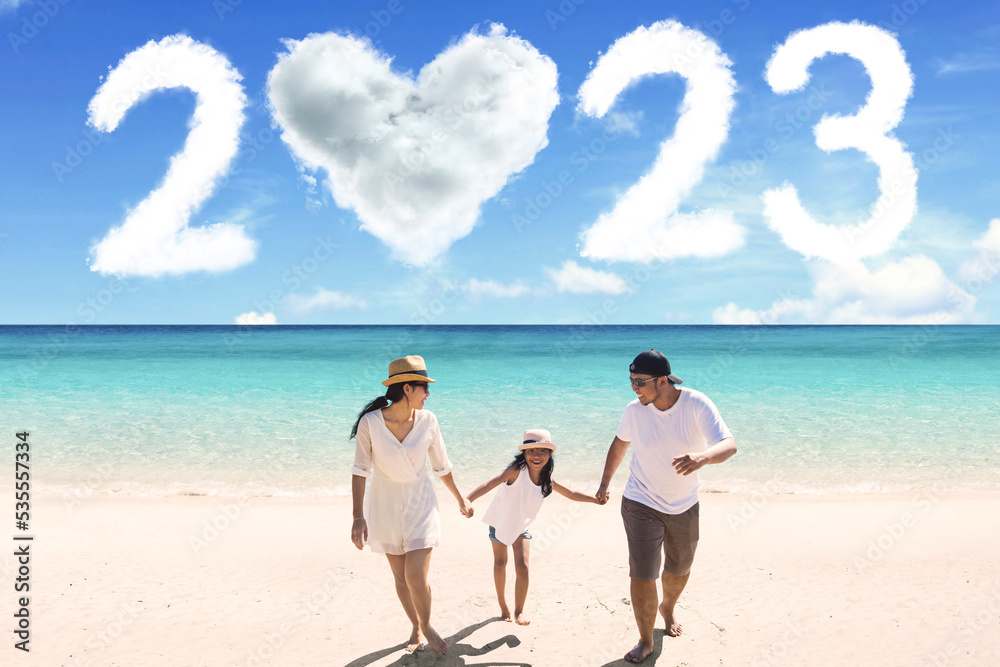Child walk with parents on beach with 2023 numbers Child walk with parents on beach with 2023 numbers