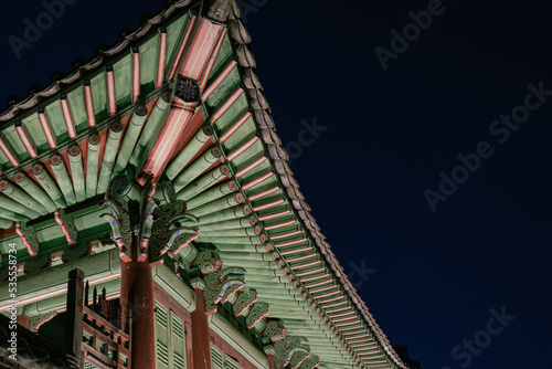 Korean traditional roof eaves, Night view of Hwaseong Haenggung Palace in Suwon, Korea photo