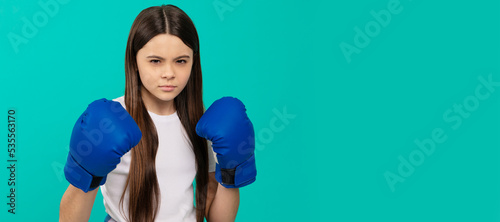 punching. determined successful kid boxer. fight for success. confident child ready for competition. Horizontal poster of isolated child face, banner header, copy space.