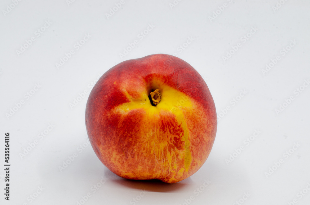 Red colored nectarine. Red nectarine fruit isolated on white background.
Red colored nectarine. Red nectarine fruit isolated on white background.