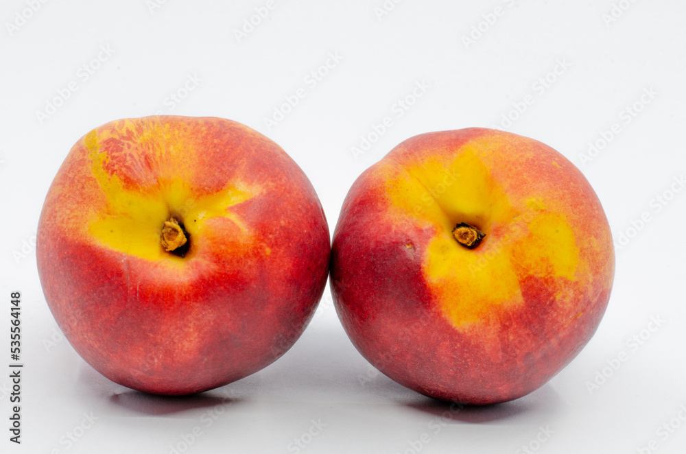 Red colored nectarines. Red nectarine fruit isolated on white background.
Red colored nectarines. Red nectarine fruit isolated on white background.