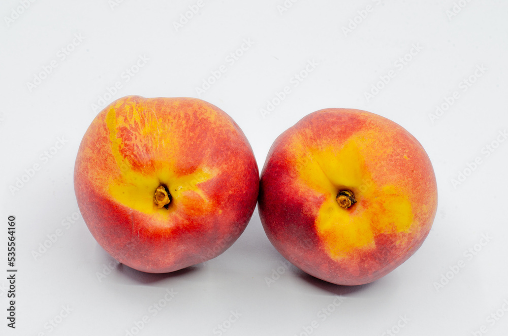 Red colored nectarines. Red nectarine fruit isolated on white background.
Red colored nectarines. Red nectarine fruit isolated on white background.