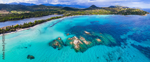 Best beaches of Corsica island - aerial panoramic view of beautiful Santa Giulia long beach with sault lake from one side and turquoise sea from other