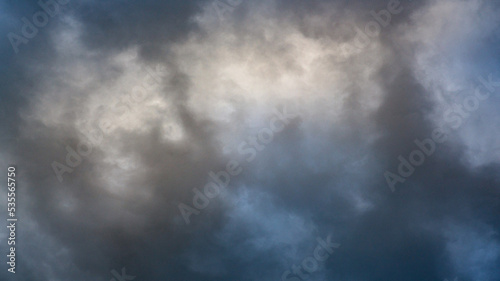 Texture of bright blue dramatic cloudy sky.