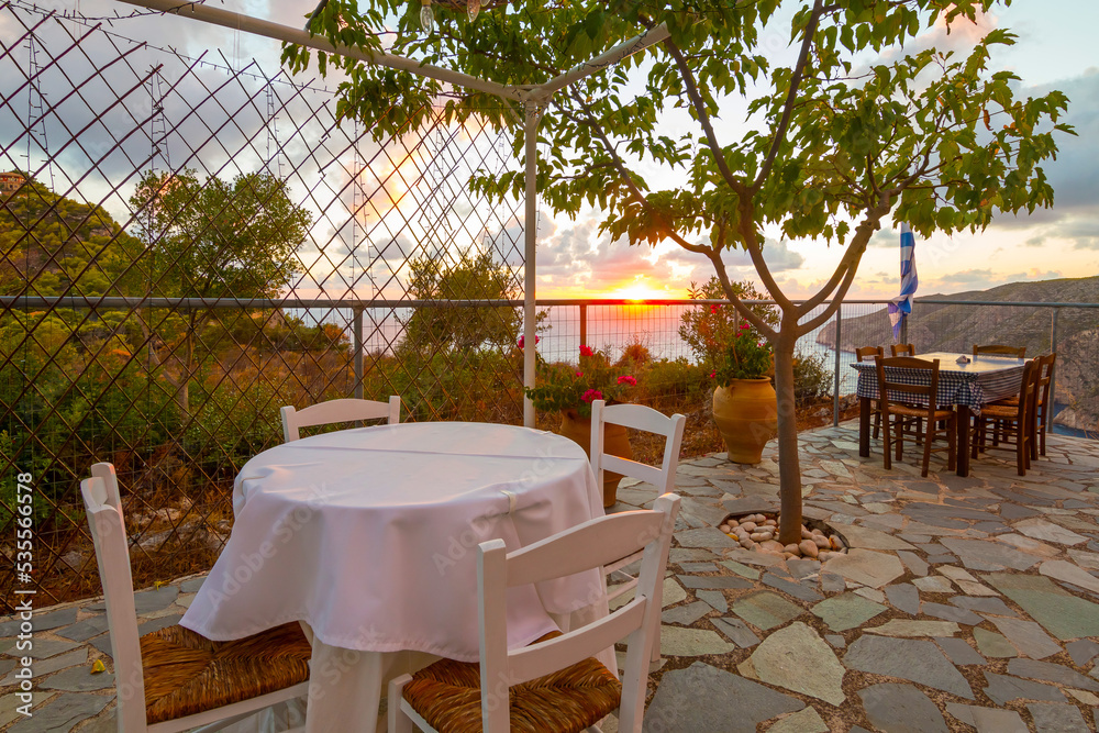 Romantic terrace during sunset at a restaurant on Zakynthos (Ionic Islands, Kampi, Greece)