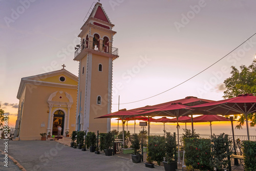 Sunrise. Bochali viewpoint in Zante, Zakynthos, Greece, popular travel destination. Bochali is a hill with holy temple of Zoodochos Pigi in Mpochali, in Ionian island of Zakynthos. photo