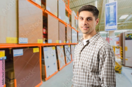 Adult man posing at work in warehouse © BillionPhotos.com