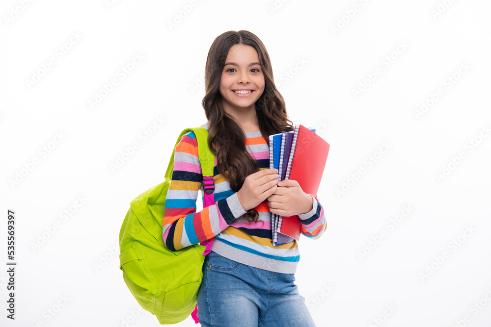 Back to school. Teenager school girl hold book and copybook ready to learn. School children with school bag on isolated white studio background. Happy girl face, positive and smiling emotions. Back to school. Teenager school girl hold book and copybook ready to learn. School children with school bag on isolated white studio background. Happy girl face, positive and smiling emotions.