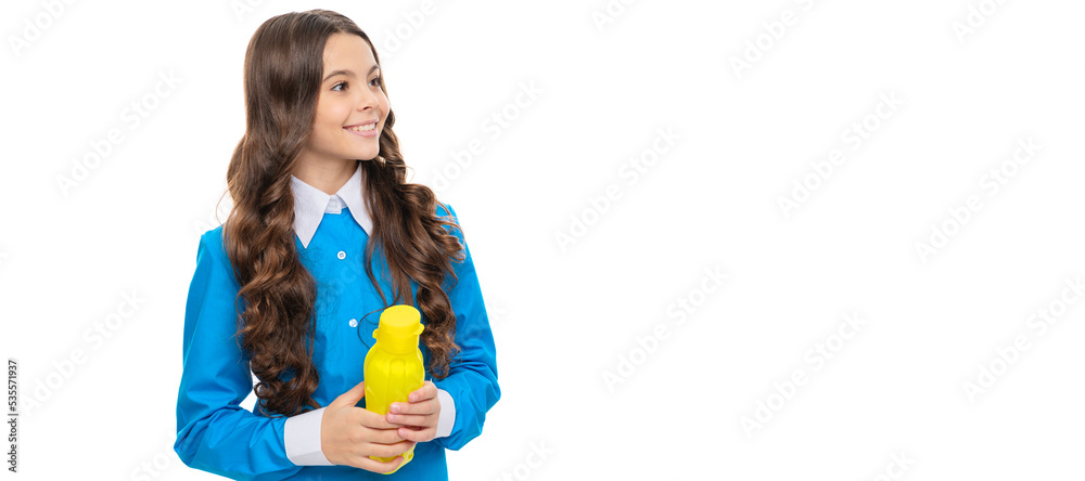 Happy child hold yellow plastic bottle with liquid food isolated on white, childhood nutrition. Horizontal poster of isolated child face, banner header, copy space.