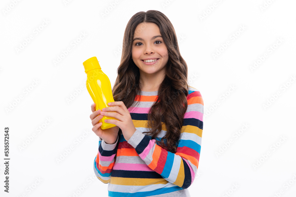 Child 12, 13, 14 years old with water bottle isolated studio background. Water bottle and healthy life. Health and water balance. Happy girl face, positive and smiling emotions. Child 12, 13, 14 years old with water bottle isolated studio background. Water bottle and healthy life. Health and water balance. Happy girl face, positive and smiling emotions.