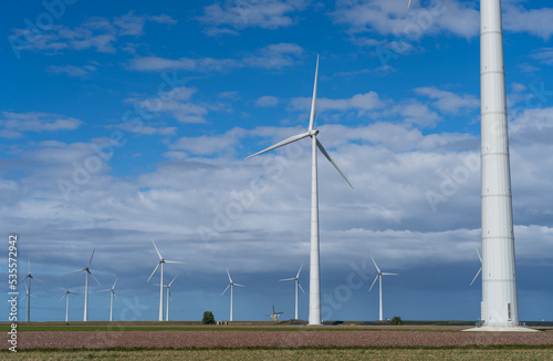 Wallpaper Mural Modern wind turbines and a traditional windmill in the Netherlands Torontodigital.ca
