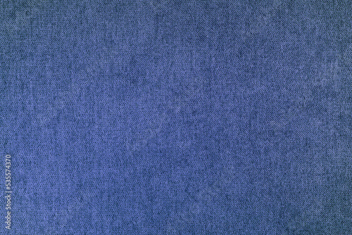 Texture background of velours blue fabric. Fabric texture of upholstery furniture textile material, design interior, wall decor. Fabric texture close up, backdrop, wallpaper.