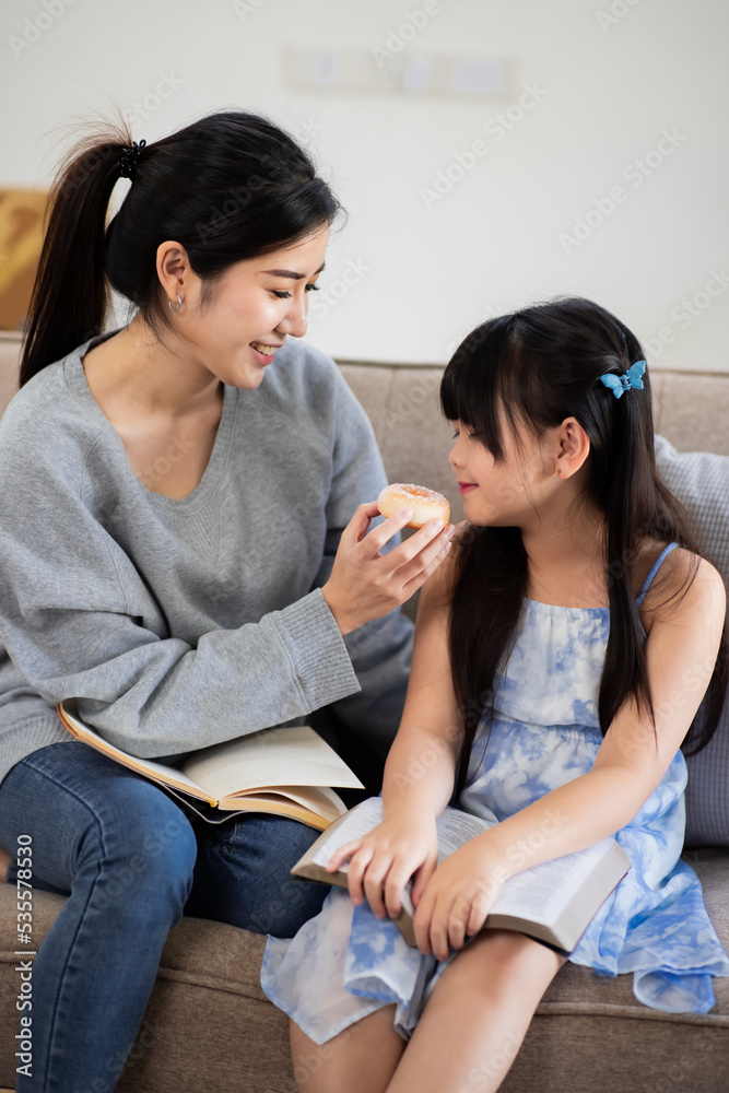 Asian happy family mother and child sitting on father shoulder playing at home, enjoying playing family, Concept of family and love.
Asian happy family mother and child sitting on father shoulder playing at home, enjoying playing family, Concept of family and love.