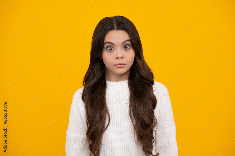 Funny face. Emotional portrait of caucasian teenager child girl isolated on studio background. Funny face. Emotional portrait of caucasian teenager child girl isolated on studio background.