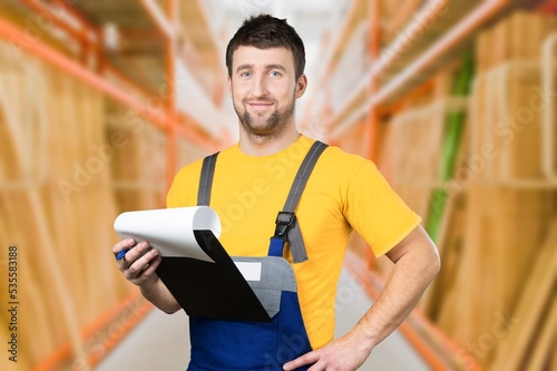 Adult man posing at work in warehouse