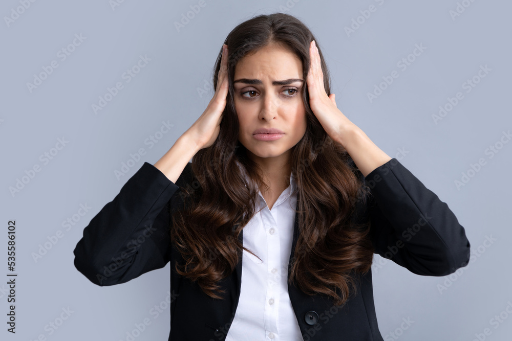 Portrait of young woman feeling stress or strain headache. Exhausted tired girl desperate and stressed because pain and migraine. Upset sad depressed model with hands on head. Portrait of young woman feeling stress or strain headache. Exhausted tired girl desperate and stressed because pain and migraine. Upset sad depressed model with hands on head.
