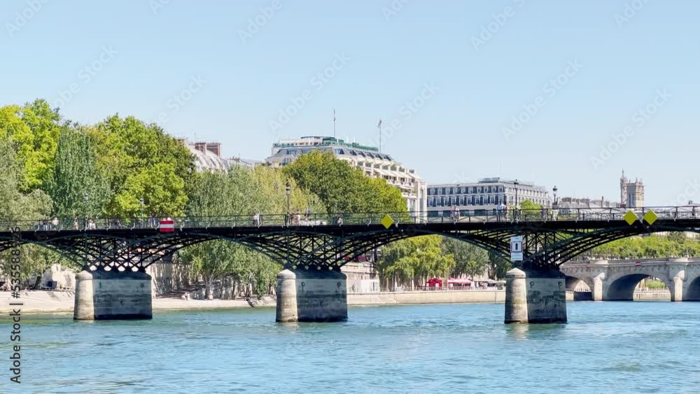 Bridge of Arts in Paris, view from boat towards pont Neuf