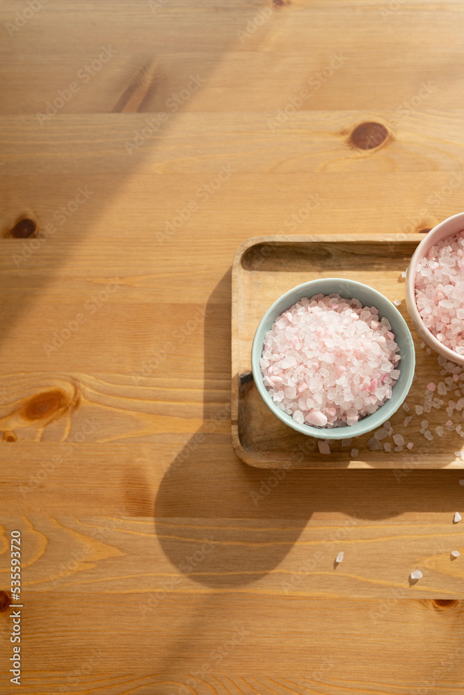 Sea salt for the bathroom on a wooden table. Free space. Sea salt for the bathroom on a wooden table. Free space.