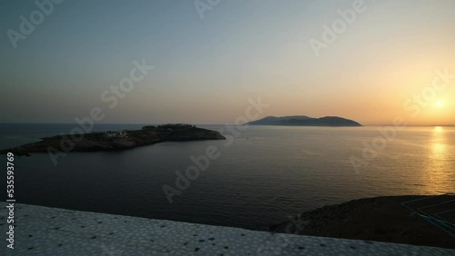 Stunning sunset view from the top of a cliff in Ios Greece photo