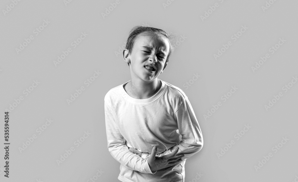 Diarrhea or gastroenteritis health problem. Child has stomachache with food poisoning. Child holding hands on belly. Black and white Diarrhea or gastroenteritis health problem. Child has stomachache with food poisoning. Child holding hands on belly. Black and white